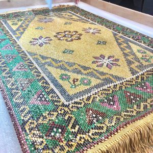 CARPET MADE WITH 26,649 PRECIOUS STONES AND 15.90 KILOGRAMS OF 18K GOLD